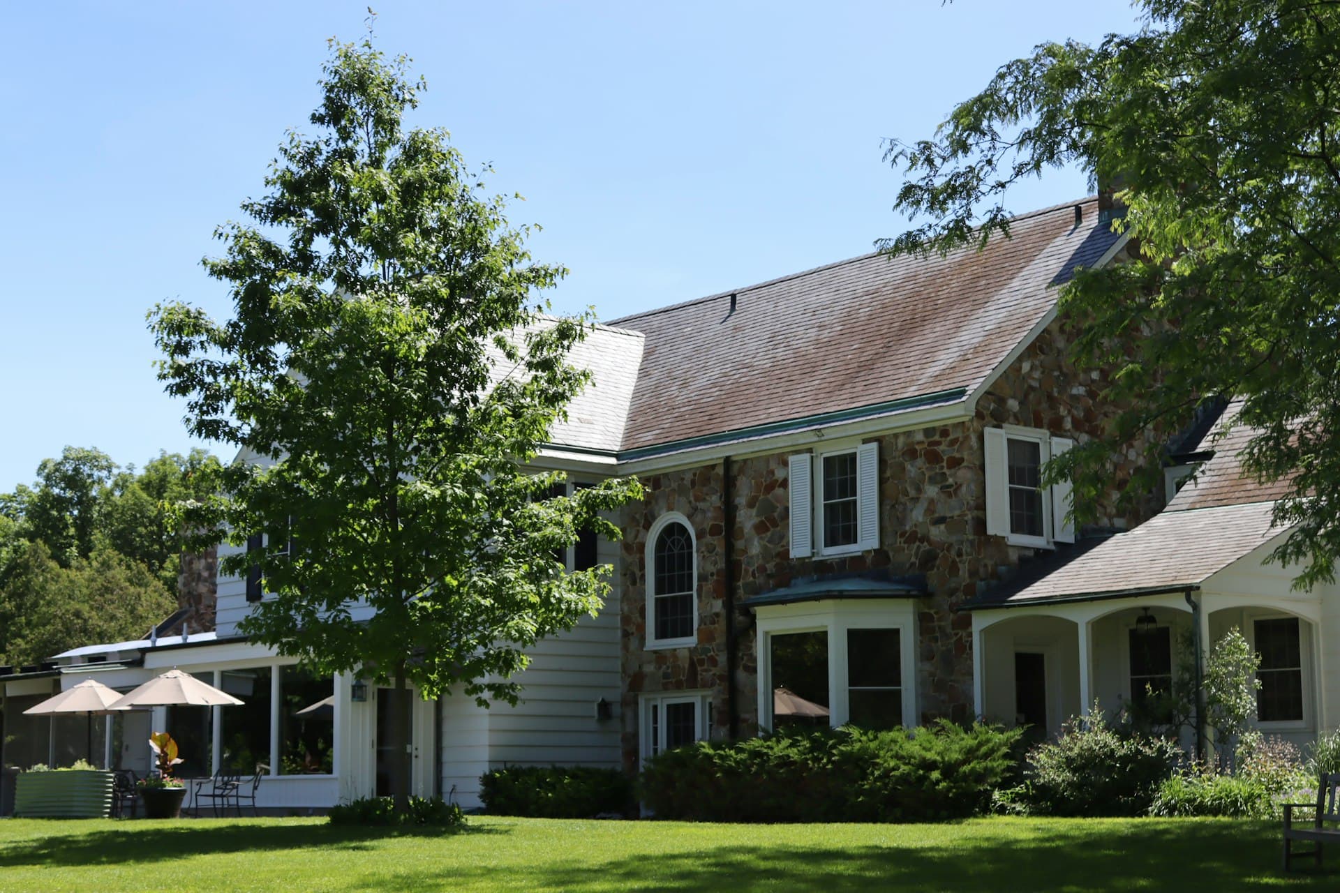 Upscale stone-and-clapboard country home with masonry facade in Northern New York